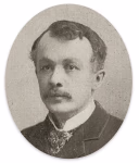 Portrait ancien en noir et blanc d’un homme en tenue formelle avec col blanc et veston, datant d’environ 1895.